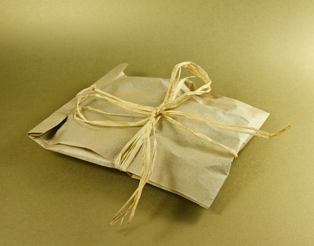  	Gift box on a golden backgroundの写真素材