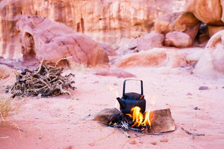 Making tea on bonfire in the desert of Wadi Rum, Jordan.の写真素材