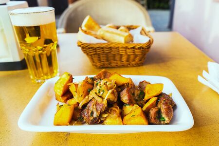 Odjakhuri: traditional georgian food with fried potatoes and meat. Selective focus.の写真素材