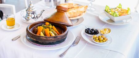 Moroccan food: tajine, olive, mint tea, salad and bread. Banner edition.の写真素材