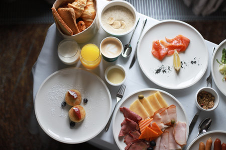 Breakfast in the room, cheesecakes, croissants, coffee. Travel breakfast. Festive breakfast. room service. rich breakfastの写真素材