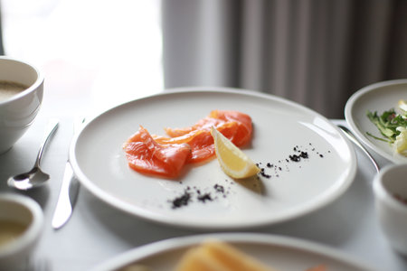Salted salmon with lemon for breakfast. Fish for breakfast. Keto breakfast, keto dietの写真素材