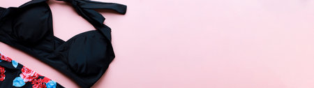 Banner Flat lay swimsuit on a pink background. swimming suit. beachwearの写真素材