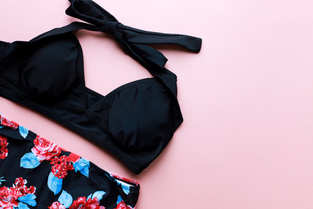 Flat lay swimsuit on a pink background. swimming suit. beachwearの写真素材