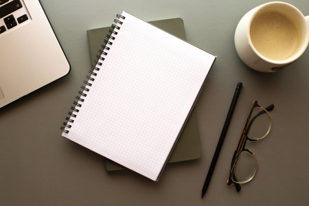 Mockup notebook on the table. Freelancer is desktop. back to school. Morning businessmanの写真素材
