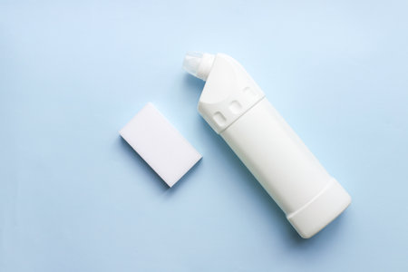 Toilet cleaner mockup on a blue background. Sponge for cleaning. Flat lay cleanser on blue backgroundの写真素材