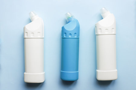 Toilet cleaner mockup. Flat lay cleaning products on blue backgroundの写真素材