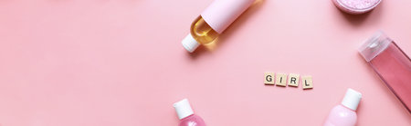 Banner Flat lay word girl from wooden letters on a pink background. bottle mockup. Spa jars. girl care. beauty routineの写真素材