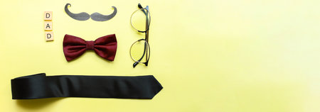 Banner Fathers day card. Flat lay glasses, mustache, bow tie. happy fathers dayの写真素材