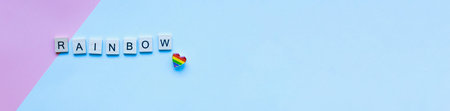Banner Flat lay pride heart icon. LGBT. Pride month and day. Word rainbow from wooden letters