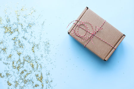 Flat lay christmas. Craft Christmas box with ribbon.の写真素材