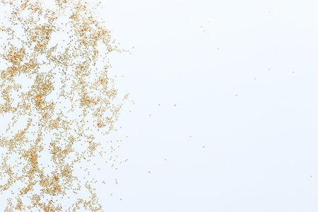 Sequins on a blue background. Glitter dexter. golden starsの写真素材