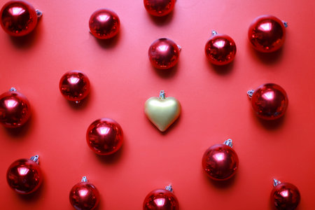 Christmas toys on a red background. golden heart toyの写真素材