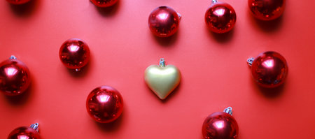Banner Christmas toys on a red background. golden heart toyの写真素材