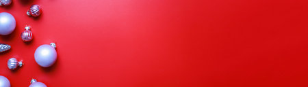 Banner Pink toys for the Christmas tree on a red background. Christmas decorationsの写真素材