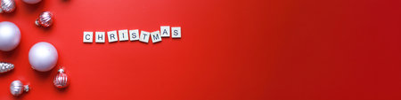 Banner Flat lay inscription Christmas on a red background. Christmas decorations. christmas cardの写真素材