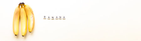 Banner Flatly bananas. The word bananas from wooden letters. Veganism, fruitarianismの写真素材