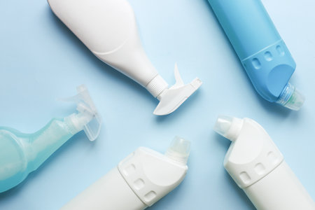 Cleaning bottle mockup. Flat lay cleaning products on blue backgroundの写真素材