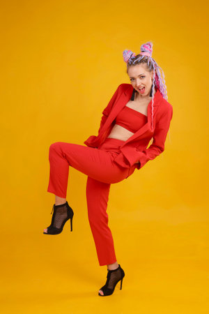 Emotional cocky model, bold person in studio on yellow background. Daring woman