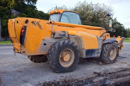 industrail construction forklift in yellow outside