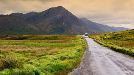 photo of a scenic irish nature landscape with tourist busの写真素材