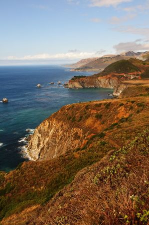 photo of a scenic landscape with lake and mountainsの写真素材
