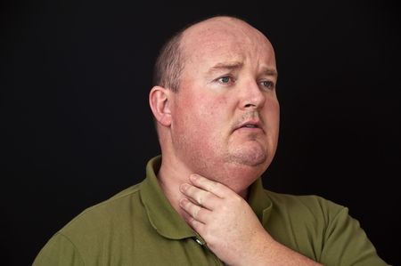 overweight male with a sore throatの写真素材