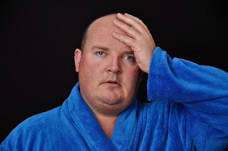 male worried in his 30's overweight on black backgroundの写真素材