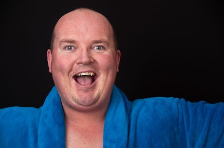  male in his 30's overweight on black backgroundの写真素材