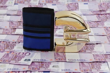 photo of 500 euro bills and gold symbol with walletの写真素材