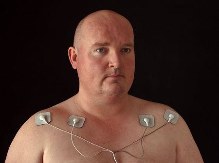 photo male with tens senors on his body for massageの写真素材