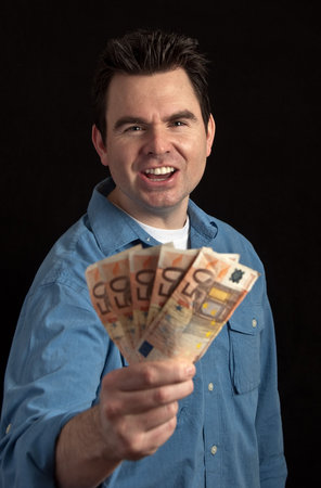 phot of angry male debt collector on black background