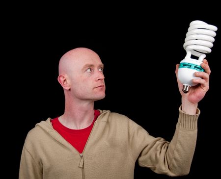 photo male holding a light bulb, business conceptの写真素材