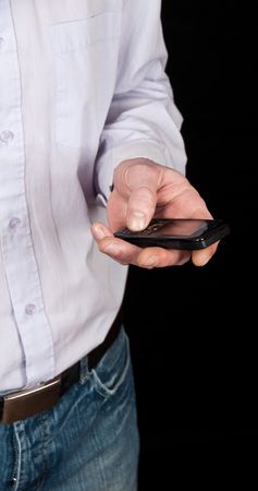 photo male using a mobile phone on blackの写真素材
