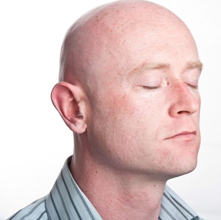 photo close up male shaved bald headの写真素材