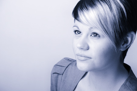 Pic Cool blue toned  Shot of a Confident Young Office Woman . Plain Wall with Copy Spaceの写真素材