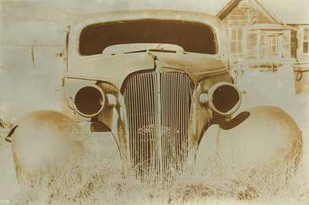 Aged sepia digital grunge distressed effect Bodie State Historic Park.