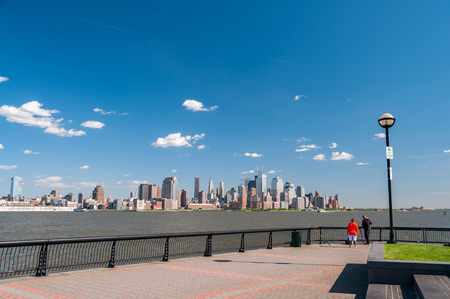 beautiful new york city skyline over hudson river, usa, america. new york city cityscape landmark on a sunny day.の写真素材
