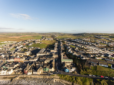 Aerial view of Ireland's top surfing town and beach in Ireland. Lahinch Lehinch town and beach in county clare. Beautiful scenic rural countryside in ireland.の写真素材