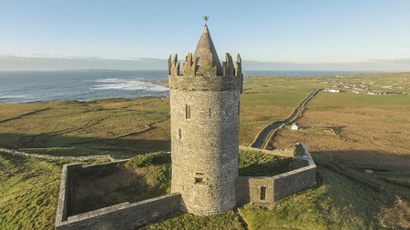 Epic Aerial Scenic Irish Castle landscape view from Doolin in County Clare. Famous tourist attraction along the wild atlantic way Ireland. Aran islands coastal beach in the distance.のeditorial素材