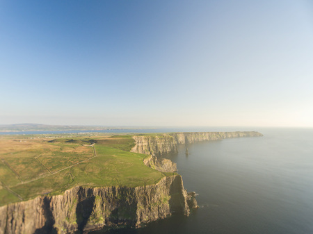 epic aerial from the cliffs of moher in county clare ireland. ireland's number 1 tourist attraction. beautiful scenic irish countryside landscape.の写真素材