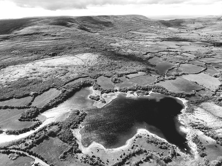 black and white landscapephotograph from the burren national park in county clare, irelandの写真素材
