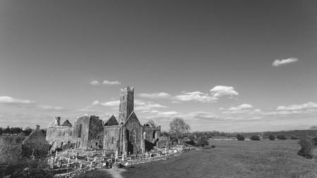 Black and white photograph of an old Irish ruined castle abbey. quin abbey in county clare Irelandの写真素材