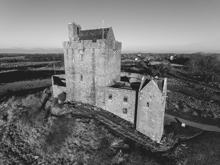 Black and white Dunguaire Castle Evening Sunset, near Kinvarra in County Galway, Ireland - Wild Atlantic Way Route. Famous public tourist attraction in Ireland.のeditorial素材