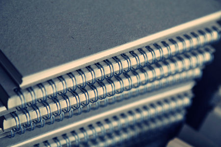 A pile of wire binding notebookの写真素材