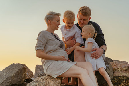 Portrait of loving caucasian family on sunset on beach. high quality photoの写真素材