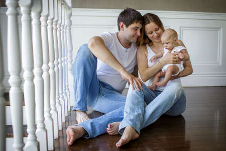 Young parents with their baby son. Image with selective focusの写真素材