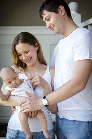 Young parents with their baby son. Image with selective focusの写真素材