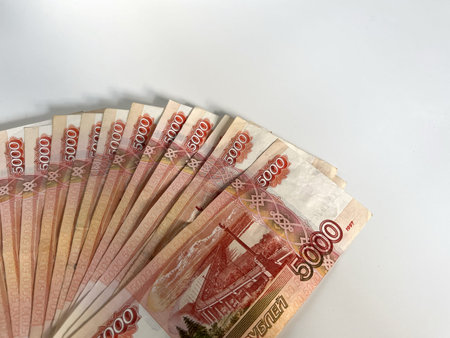 Fan of five thousand rubles banknotes. Russian currency on white backgroundMoney background and...