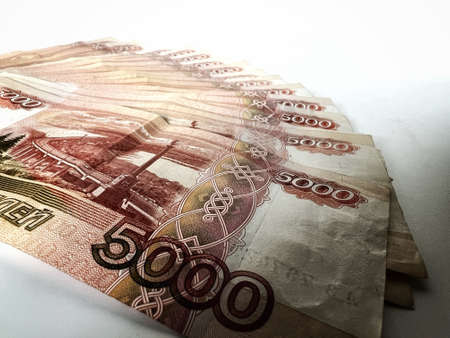 Fan of five thousand rubles banknotes. Russian currency on white backgroundMoney background and texture. Image with selective focusの写真素材